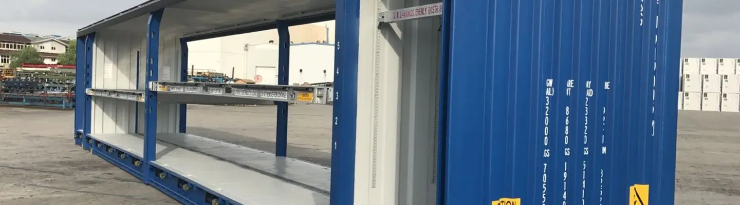 Large steel shipping container placed on-site, illustrating modular infrastructure for storage or temporary use.