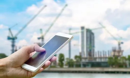 cell phone in front of worksite