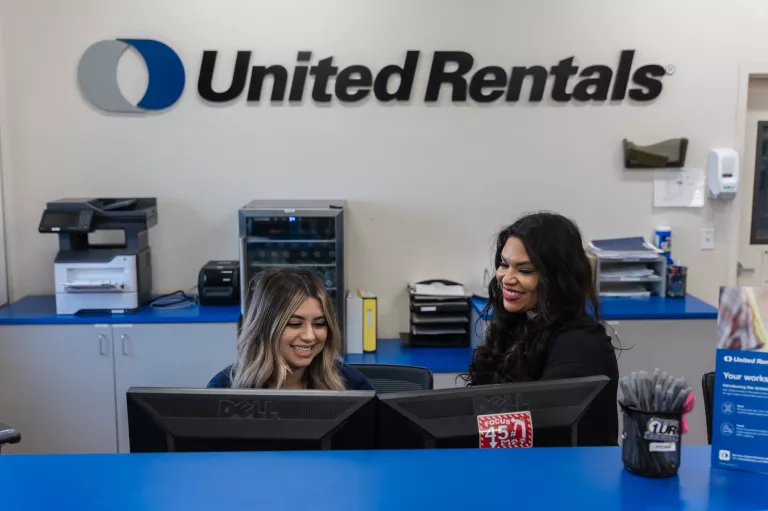 UR employees behind rental counter