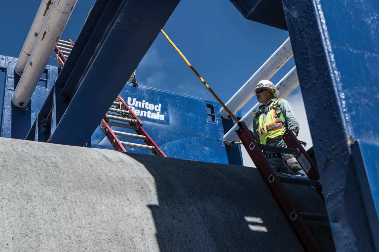 Worker using safety equipment
