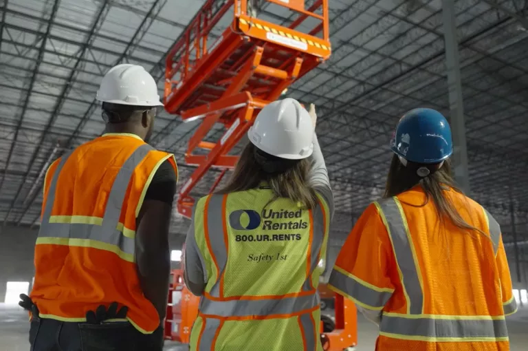 Three employees wearing PPE