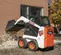 White, black and orange BOBCAT 600-850 lb. Skid Steer