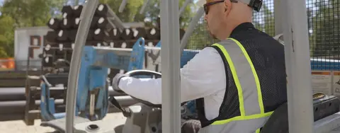 Worker using equipment at a jobsite