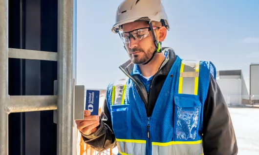 man on jobsite with turnstiles