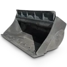 A close-up of a tilt bucket attachment on construction machinery, used for digging and grading uneven terrain.