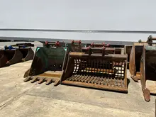 Sieve Bucket - A sieve bucket attachment, used for sorting and seaparting materials.                                                                                                                  Multi-Processor/Pulveriser - Multi-processor, or also known as a pulveriser, in action, mounted on an excavator between rotating sorting grabs.                                                                                                                                                                           