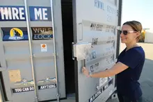 New shipping container featuring an upgraded lock design, highlighting enhanced security and modern construction features.