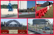 Temporary safety barriers installed along a roadside construction zone to protect workers and guide vehicle traffic safely.