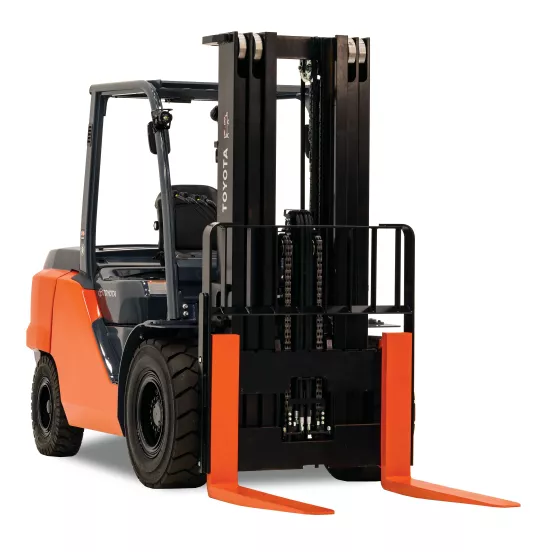 Front angled view of an orange and black Toyota warehouse forklift with a black mast, orange forks and an open cabin.