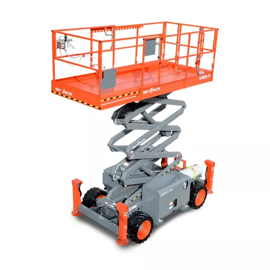 Side view of a partially extended orange scissor lift with gray base, black wheels, and safety railing.